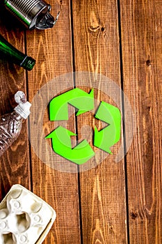 Eco concept with recycling symbol on table background top view mock-up