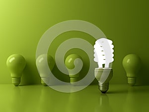 Eco energy saving light bulb , one glowing compact fluorescent lightbulb standing out from unlit incandescent bulbs