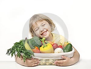 Eco fresh grown food concept.Child holding basket with organic fruits and vegetables. Healthy kid`s nutrition