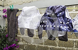 Eco-friendly baby cloth diapers hanging outside to dry