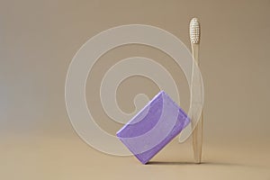 Eco friendly bamboo toothbrush and Handmade aromatic spa lavender soap. Natural additives and extracts. Bar of lavender