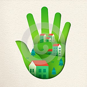 Eco friendly city in green paper cut hand