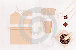 Eco friendly coffee template for design, advertising and branding - brown paper cup, blank notebook, label, card, mortar.