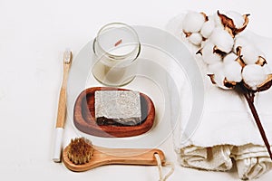 Eco friendly cosmetics. Candle, washing brush, toothbrush, handmade soap. Hygge, autumn cozy mood, comfort concept.