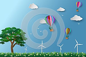 Eco friendly and environment conservation concept,colorful hot air balloon with tree flying over the meadow