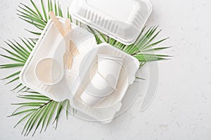 Eco friendly food packaging on white quartz background