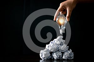 Eco-Friendly Green Energy Concept: Saving the Planet with Creative Bulb Recycling and Innovation. Green Hand Holding Bulb