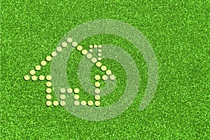 Eco Friendly House concept. Figure of house made of water drops. Icon on green grass background with copyspace