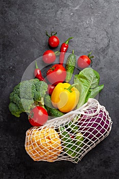 Eco friendly mesh shopping bag with fresh vegetables