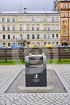 Eco-friendly modern container/bins for separate collection of garbage - glass, paper, general waste. Selective focus