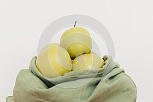 Eco friendly plastic free grocery delivery and shopping. Fresh apples in eco cotton bag on white