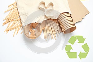 Eco friendly products and recycling symbol on white background, flat lay