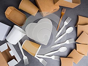 Eco friendly recycling paper packing for fast food on grey background. Cups, containers, box, table cutlery