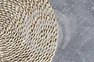 Eco-friendly round natural corn straw placemat table mat on a concrete look coffee table