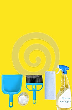 Eco friendly set of cleaning tools on yellow background
