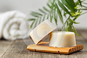 Eco friendly solid shampoo soap bar on wooden dish