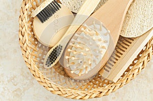 Eco friendly toiletries set with wooden hairbrush, hair comb, bar of soap and bamboo toothbrushes.