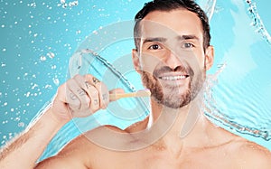 Eco friendly toothbrush, water and portrait of man on blue background for wellness, hygiene and brushing teeth. Cleaning