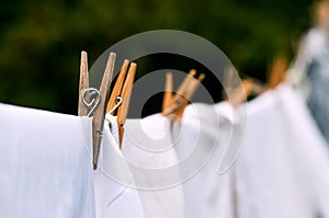 Eco-friendly washing line white laundry drying outdoors