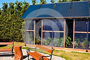 Eco glass house with solar panels photo