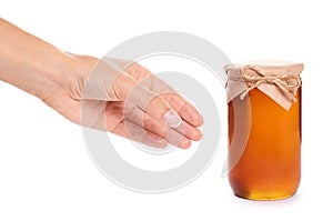 Eco home made honey in jar in hand isolated on white background