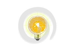 Eco lamp. Save electricity. Orange fruit in lamp bulb isolated on white background. New idea concept