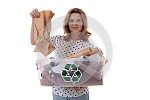 Eco living and environment concept - smiling caucasian woman holding paper in plastic box with recycling symbol, isolated over