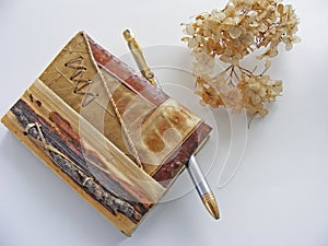 Eco notebook of natural material / twig, leaf, bark / isolated photo
