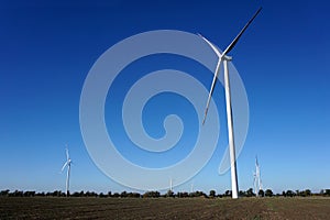 Eco power, wind turbines with blue sky. wind turbine for alternative electricity.renewable electric farm with sustainable eco