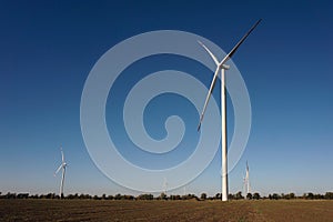 Eco power, wind turbines with blue sky. wind turbine for alternative electricity.renewable electric farm with sustainable eco