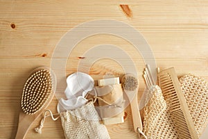 eco self care kit, bamboo and tin items, cotton sponges and homemade soap on wooden background