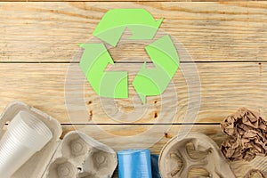 Eco symbol. recycling. eco concept on natural wooden table. waste recycling. view from above