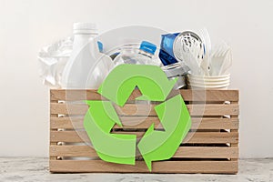 Eco symbol and trash in the box. recycling. waste recycling. on a light background