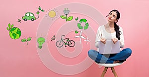 Eco theme with woman using a laptop