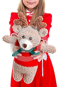 Eco toys, the deer soft toy in the christmas girls hands on the white background