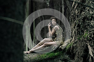 Eco woman sitting on the trunk