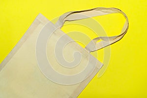 Ecofriendly bag on bright yellow background. Zero waste concept