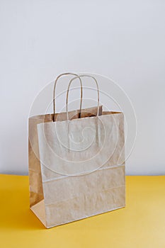 Ecologic craft package on a yellow table. photo