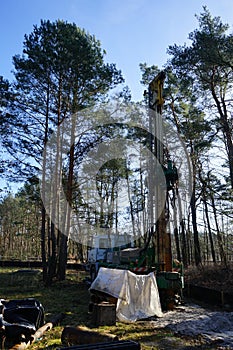 Ecological activities. A water well driller in a forest zone drills a well to extinguish forest fires. Berlin, Germany