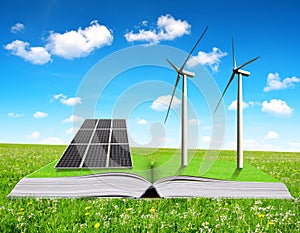 Ecological book with solar panel and wind turbines on meadow.