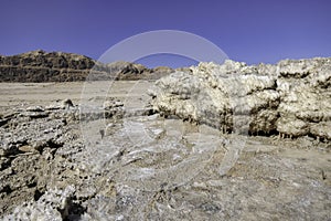 Ecological catastrophe of the disappearing Dead Sea. Erosion and salt formations on the surface of the earth. l