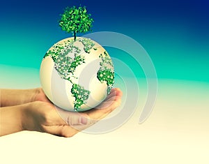 Ecological concept of the environment with the cultivation of trees on the ground in the hands. Planet Earth. Physical