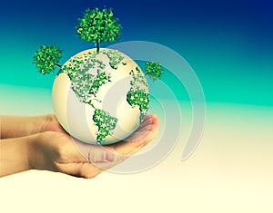 Ecological concept of the environment with the cultivation of trees on the ground in the hands. Planet Earth. Physical