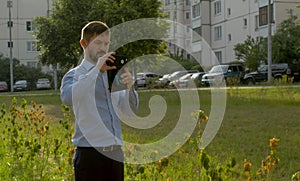 Ecological inspector shooting dried up shrub in public park