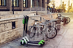 Ecological and personal transport in town. Bike and electric scooter