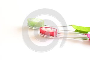Ecological plastic toothbrushes isolated on the white. Teeth care, life style photo