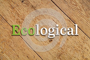 `Ecological` text on a wooden background.