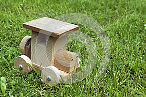 Ecological wooden car in grass