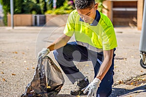 Ecologist man collecting garbage. Guy picking up trash