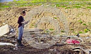 Ecologist during the research on garbage dump. photo